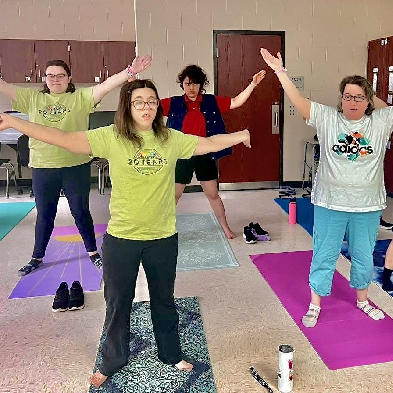 Adapted yoga class cool down stretching at the end of class