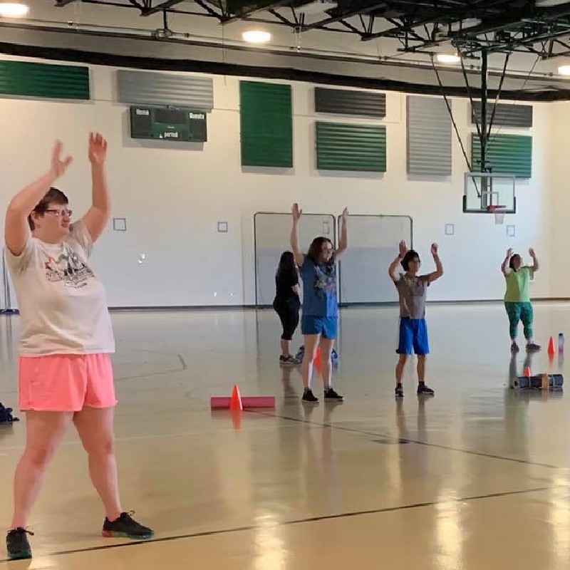 adapted fitness class stretching at the beginning of class 