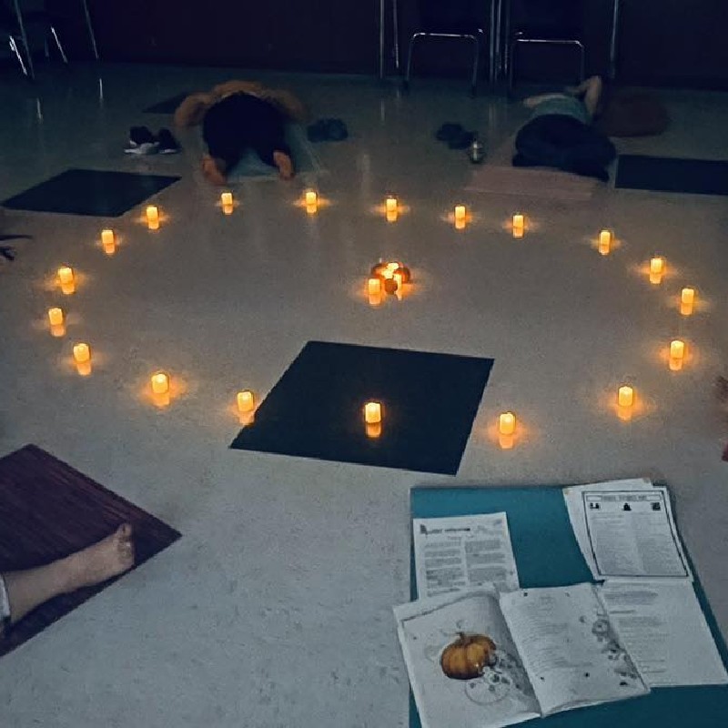 meditation time with candles during yoga class.